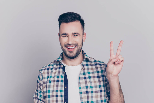 Portrait of young, smiling man in checkered shirt with stubble,  - Foto, Imagem