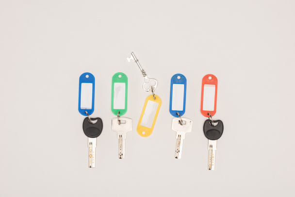 top view set of different keys with colorful labels isolated on white - Fotografie, Obrázek