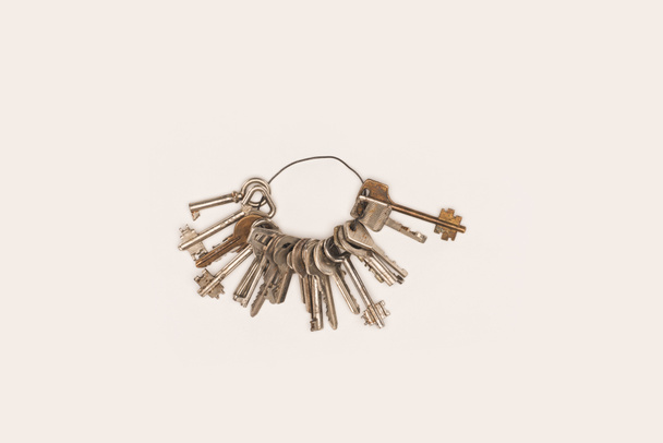 top view bunch of vintage keys isolated on white - Фото, изображение