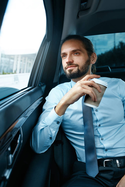 Man Drinking Coffee In Car Portrait - Photo, Image
