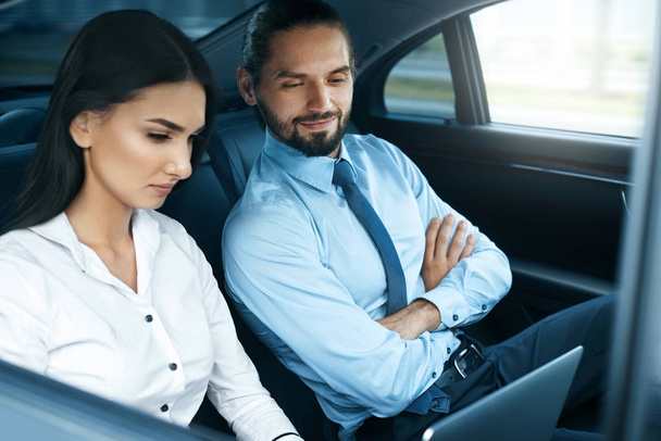 Business Man And Woman Working In Car. - Photo, image