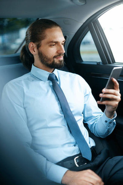 Young Successful Man Working On Phone Sitting In Car. - Photo, image