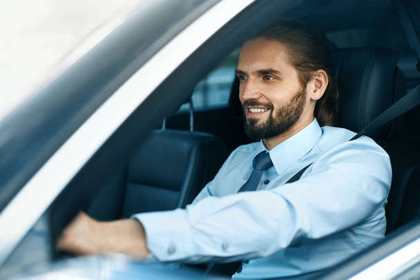Man Driving Car. Portrait Of Smiling Male Driving Car - Foto, immagini