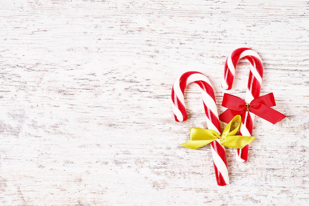 Christmas background. Christmas greeting card with candy cane. Copy space - Zdjęcie, obraz