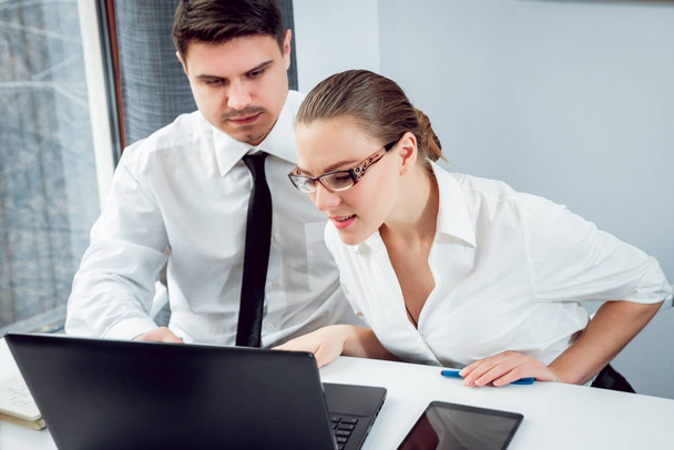 Woman adviser with businessman discussing strategy in office - Photo, Image