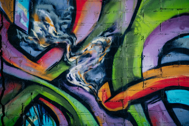close up of colorful graffiti on wall in city, street art  - Photo, Image