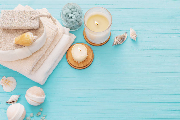 Spa concept with candles on blue wooden background - Photo, image