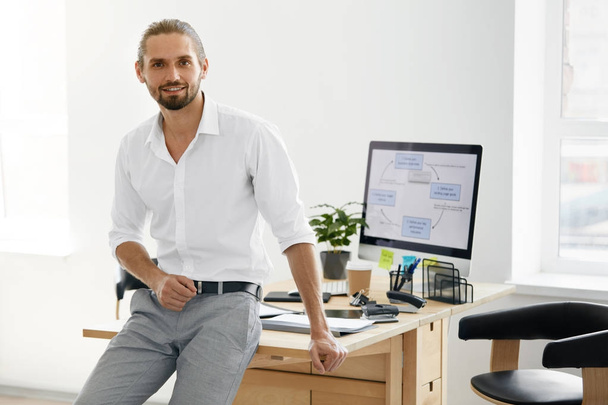 Confident Male Worker Standing In Office - Photo, Image