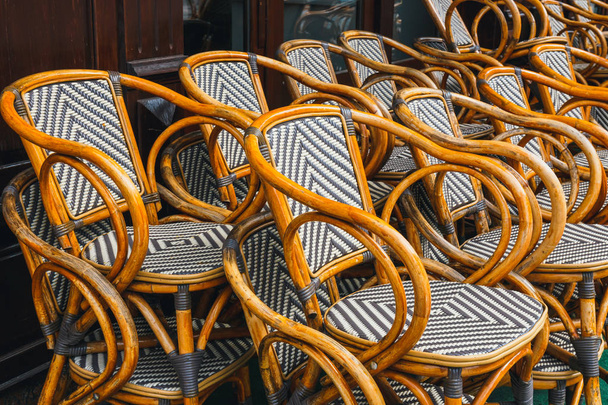 many empty wooden chairs outside the restaurant - Photo, Image