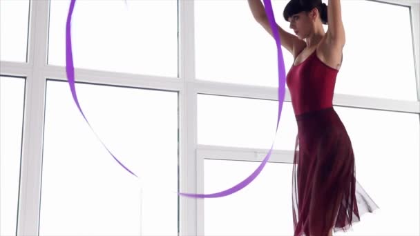 Rhythmic gymnastics training. Dance with ribbon - Footage, Video