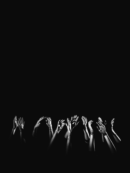 banner social concept. hands in paint raised up on a black background symbolizing fear, hope, struggle and a request for help. Place for text, copyright - Photo, Image