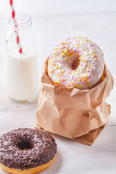 Donuts with milk on a light background - Photo, image