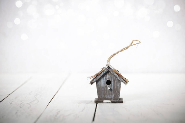 birdhouse on rustic wooden background - Fotó, kép