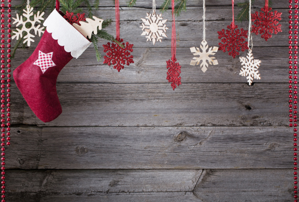 Christmas stocking hanging against wooden background - Photo, Image