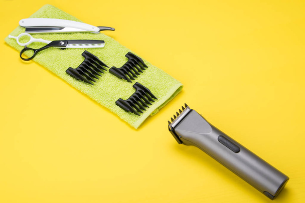 set of tools for hair cutting, on a yellow background - Foto, Imagem