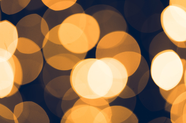 abstract golden bokeh on black background - Foto, immagini