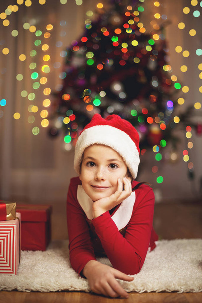 Cute girl with presents on New Years Eve - 写真・画像