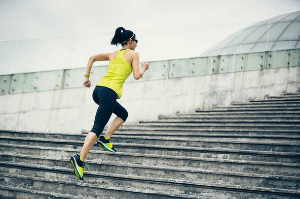 Young fitness sporty woman running upstairs - Foto, Imagem