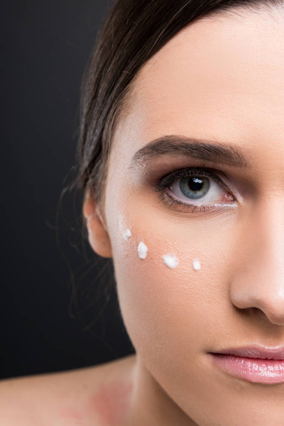Half portrait of female model face with moisturized cream - Fotoğraf, Görsel