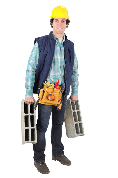Man carrying breeze blocks - Φωτογραφία, εικόνα