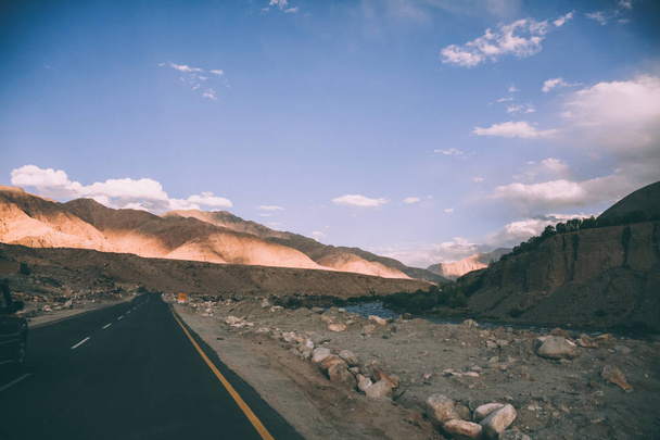 asphalt road and majestic rocky mountains in Indian Himalayas, Ladakh region - Φωτογραφία, εικόνα