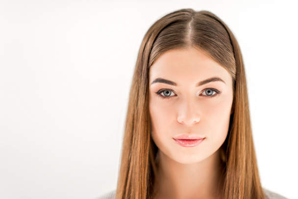 headshot of beautiful young woman with straight hair looking at camera isolated on white - Foto, immagini