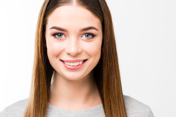 head and shoulders shot of beautiful smiling woman with straight hair looking at camera isolated on white - Photo, Image