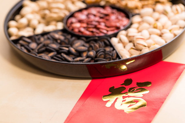 Chinese red pocket with a word luck and assorted snack box  - Foto, Imagem