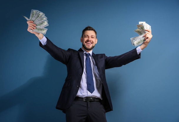 Stock exchange broker with money on color background - Photo, image