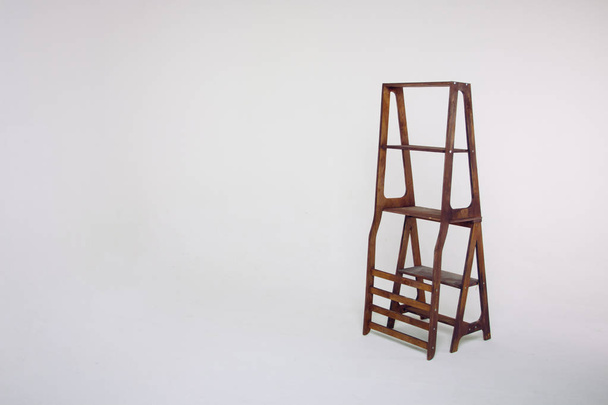 unusual wooden stepladder on a white background - Φωτογραφία, εικόνα
