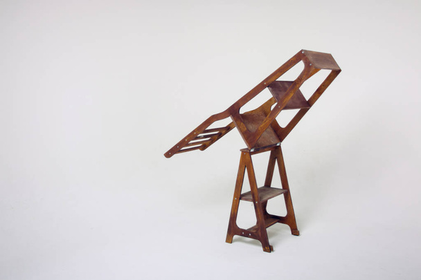 metal bolt in a wooden chair close-up - Fotoğraf, Görsel
