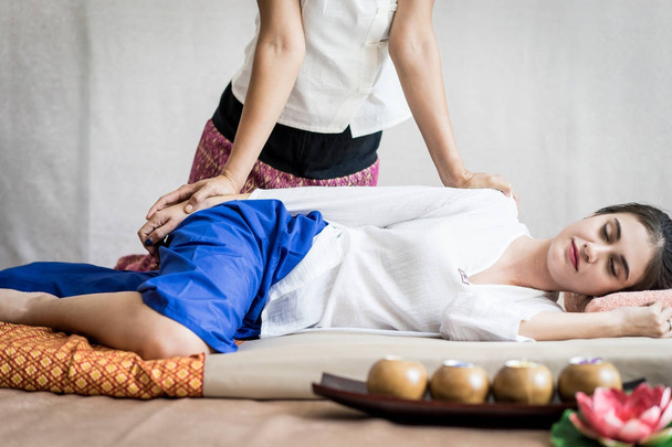 Woman is receiving arm massage in Thai Massage spa - Photo, Image