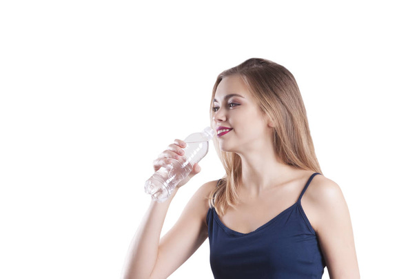 beautiful sports girl with bottle of water portrait isolated - Foto, imagen