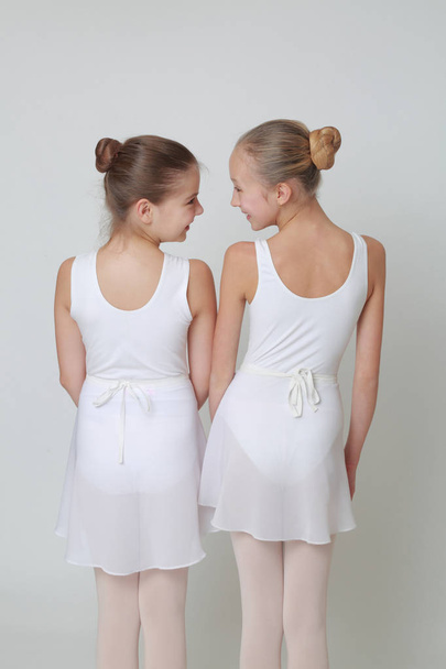 Studio image of caucasian teen ballerinas over white background - Fotoğraf, Görsel