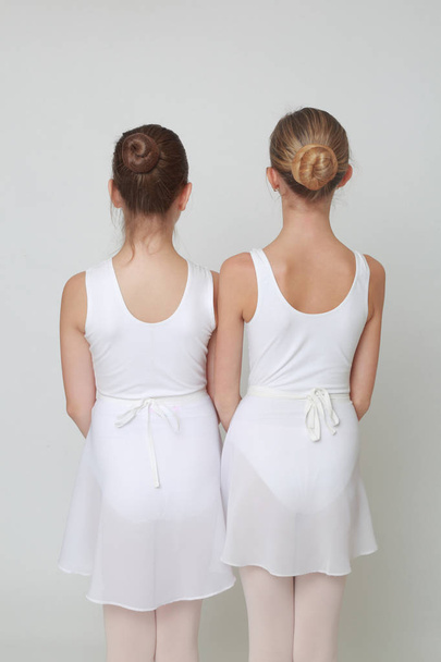 Studio image of caucasian teen ballerinas over white background - Fotografie, Obrázek