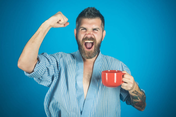 Bearded hipster with red milk cup. - Fotoğraf, Görsel
