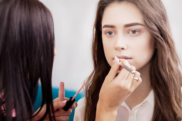 Backstage scene: Professional Make-up artist doing makeup for yo - Фото, изображение