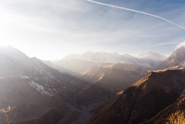 An inspiring view of the high Caucasus mountains in the morning sun - Fotoğraf, Görsel