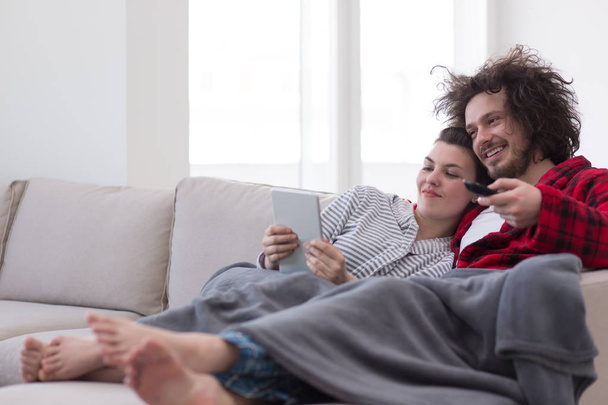 couple relaxing at  home with tablet computers - Foto, imagen