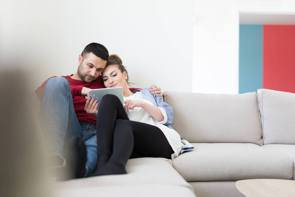 couple relaxing at  home with tablet computers - Foto, immagini