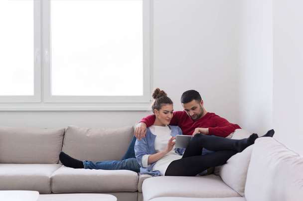 couple relaxing at  home with tablet computers - Foto, immagini