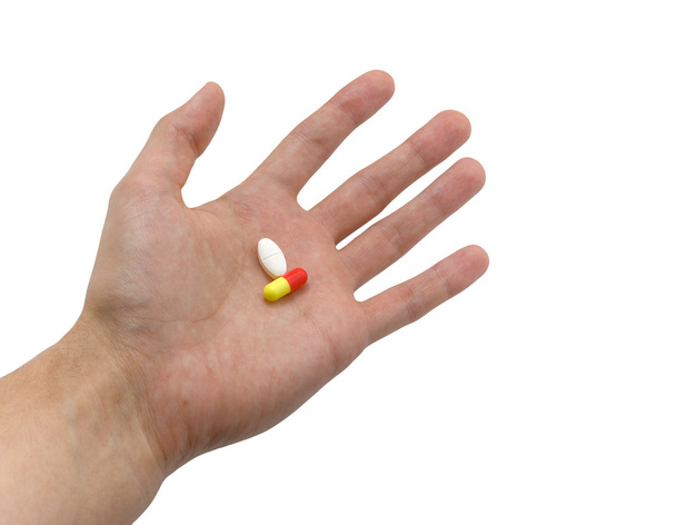 Hand with pills - Фото, изображение