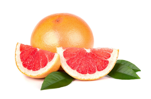 Pink grapefruit and slices isolated on white background with clipping path. Isolated grapefruits. Fresh grapefruit with green leaves isolated. - Photo, Image