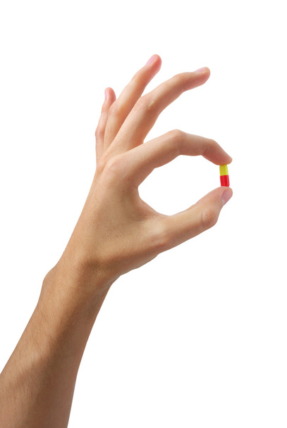 Hand with pill - Valokuva, kuva