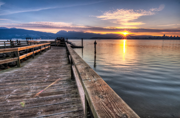 Pier with Sunrise Sunstar
 - Фото, изображение