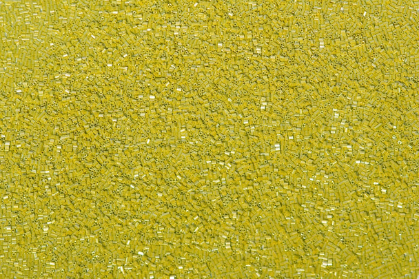 Lentejuelas de tela en colores dorados. Tela de moda con brillo, lentejuelas
 - Foto, Imagen