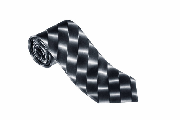 gros plan d'une élégante cravate élégante roulée et isolée sur un fond blanc, cravate motif d'échecs noir et blanc
 - Photo, image