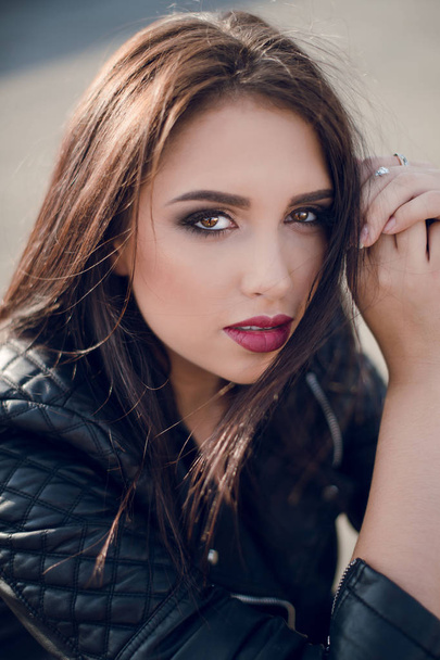 Beautiful young  woman in black jacket posing   - Fotografie, Obrázek
