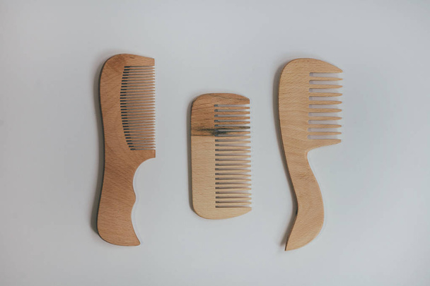 Wooden Comb on a neutral gray background - Φωτογραφία, εικόνα