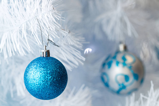 Christmas tree decorations hanging on a Christmas tree - Фото, изображение